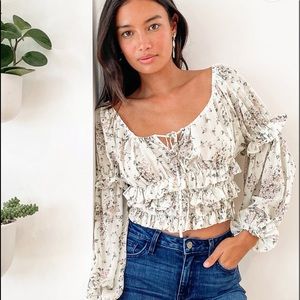 NWT cream floral print ruffled top